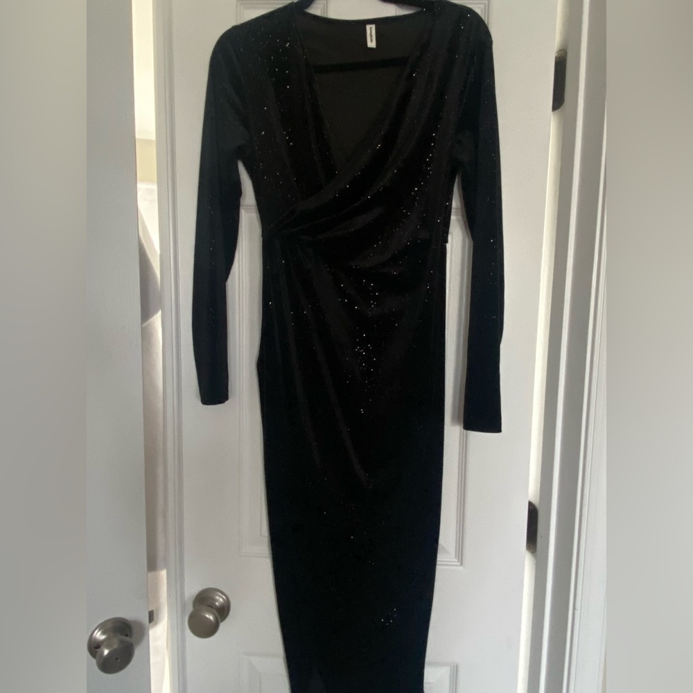 Black long sleeve mid length dress. Never worn; new.